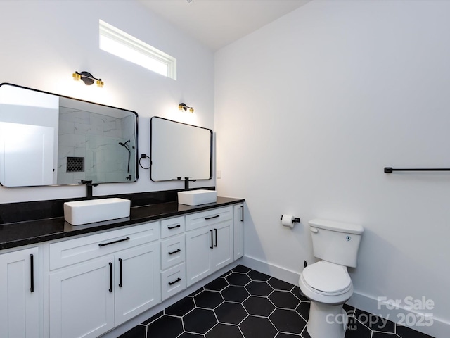 3007 W Blvd, Charlotte, NC 28208 - full bathroom featuring walk in shower, baseboards, double vanity, toilet, and tile patterned flooring