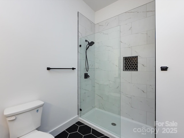 3007 W Blvd, Charlotte, NC 28208 - full bath with tile patterned floors, a tile shower, baseboards, and toilet