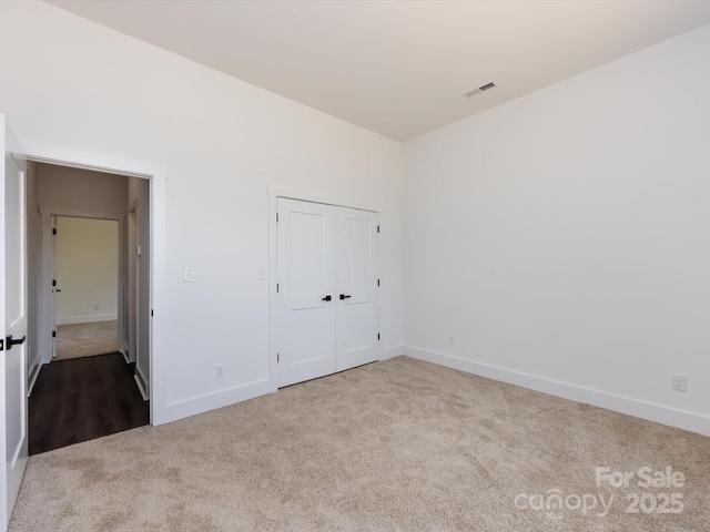 3007 W Blvd, Charlotte, NC 28208 - unfurnished bedroom featuring carpet floors, baseboards, and a closet