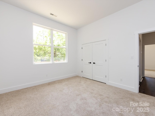 3007 W Blvd, Charlotte, NC 28208 - unfurnished bedroom with carpet flooring, baseboards, and a closet
