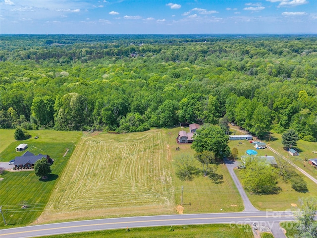 aerial view featuring a view of trees