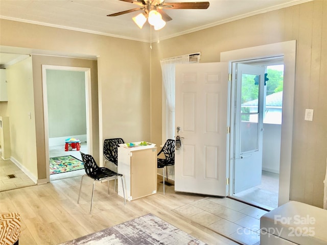 439 17th St, Cramerton, NC 28032 - foyer entrance featuring light wood-style floors, a ceiling fan, crown molding, and baseboards