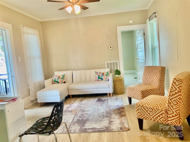 439 17th St, Cramerton, NC 28032 - living room with ceiling fan, plenty of natural light, crown molding, and wood finished floors