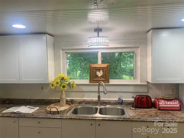 439 17th St, Cramerton, NC 28032 - kitchen with a sink, plenty of natural light, and white cabinetry