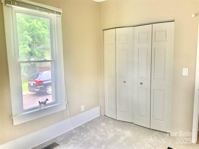 439 17th St, Cramerton, NC 28032 - unfurnished bedroom featuring light carpet, a closet, and baseboards