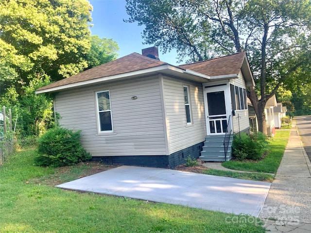 439 17th St, Cramerton, NC 28032 - view of home's exterior with a chimney, a shingled roof, a patio area, and entry steps