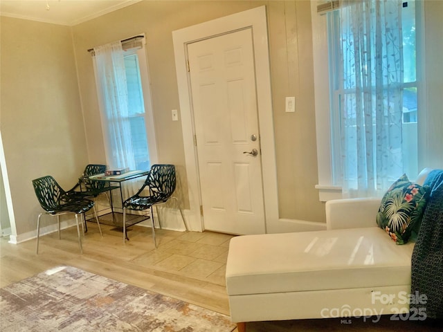 439 17th St, Cramerton, NC 28032 - entrance foyer featuring wood finished floors, plenty of natural light, ornamental molding, and baseboards