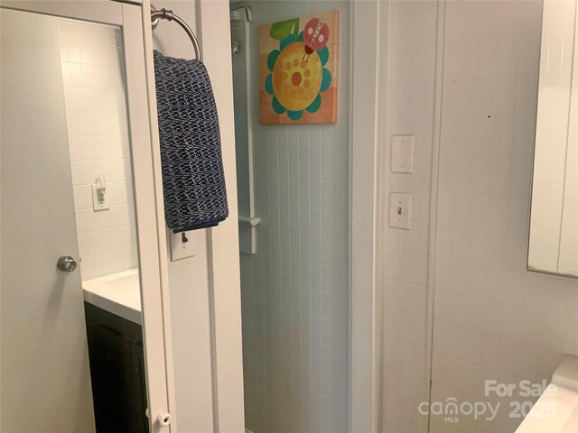 439 17th St, Cramerton, NC 28032 - bathroom with vanity and tile walls