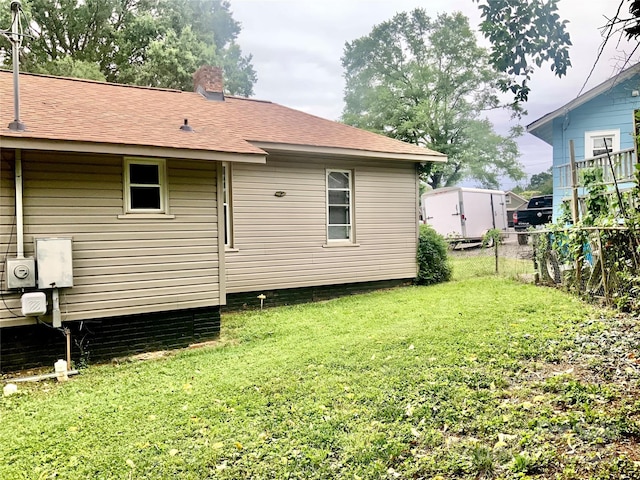 439 17th St, Cramerton, NC 28032 - rear view of house with a shingled roof and a chimney