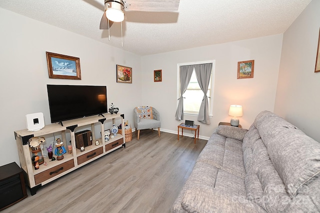 2263 Starbrooke Dr, Newton, NC 28658 - living room with baseboards, a ceiling fan, a textured ceiling, and wood finished floors