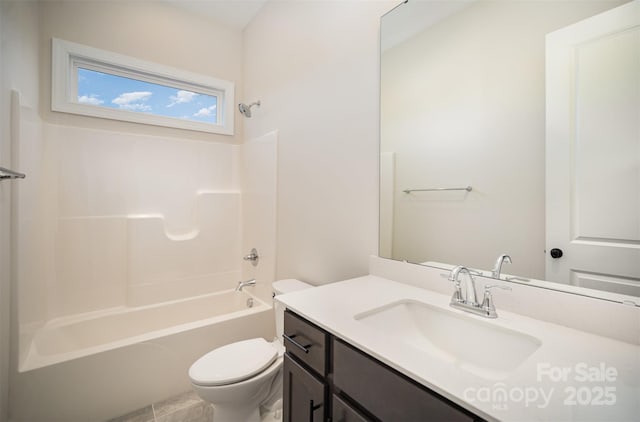 bathroom featuring toilet, vanity, and washtub / shower combination