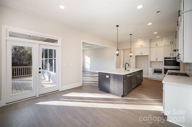 515 Edmunds Ln Unit 38, Clover, SC 29710 - kitchen with light wood-style flooring, white cabinets, a sink, light countertops, and recessed lighting