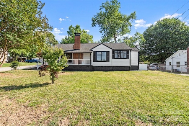 2609 Lowell Rd, Gastonia, NC 28054 - view of front of home with a chimney, fence, a shingled roof, a front lawn, and crawl space