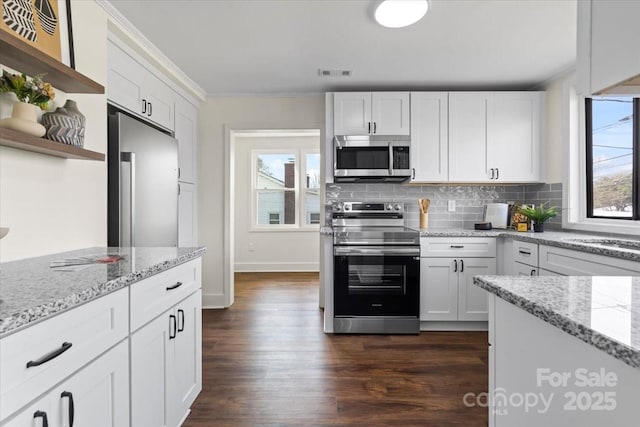 2609 Lowell Rd, Gastonia, NC 28054 - kitchen with white cabinets, open shelves, visible vents, crown molding, and appliances with stainless steel finishes