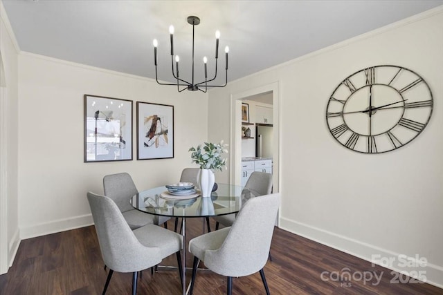 2609 Lowell Rd, Gastonia, NC 28054 - dining space with wood finished floors, ornamental molding, baseboards, and a notable chandelier