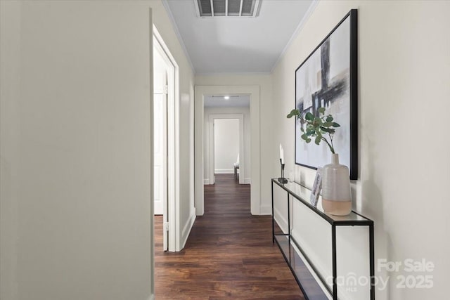 2609 Lowell Rd, Gastonia, NC 28054 - hall featuring dark wood finished floors, visible vents, baseboards, and ornamental molding