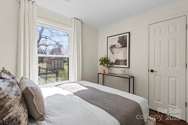 2609 Lowell Rd, Gastonia, NC 28054 - bedroom featuring dark wood-style floors and crown molding