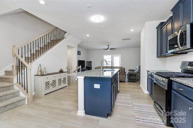 147 Morning Gap Pkwy, Fort Mill, SC 29715 - kitchen featuring a ceiling fan, a sink, open floor plan, appliances with stainless steel finishes, and visible vents