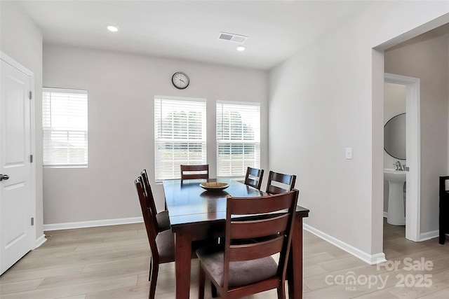 147 Morning Gap Pkwy, Fort Mill, SC 29715 - dining area featuring light wood finished floors, baseboards, visible vents, and a healthy amount of sunlight