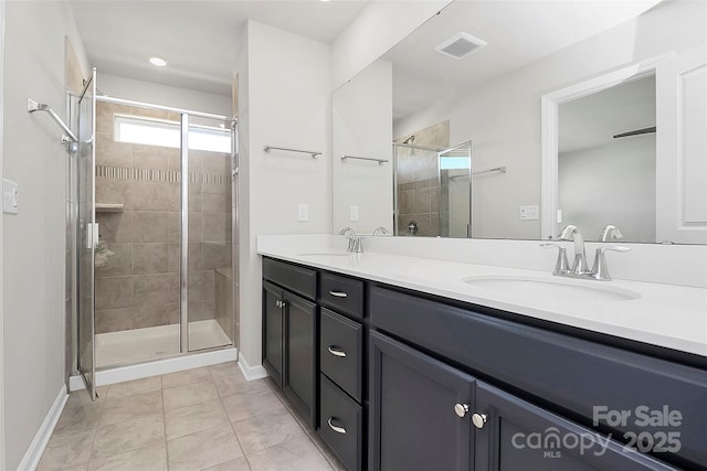 147 Morning Gap Pkwy, Fort Mill, SC 29715 - bathroom featuring double vanity, visible vents, a stall shower, and a sink