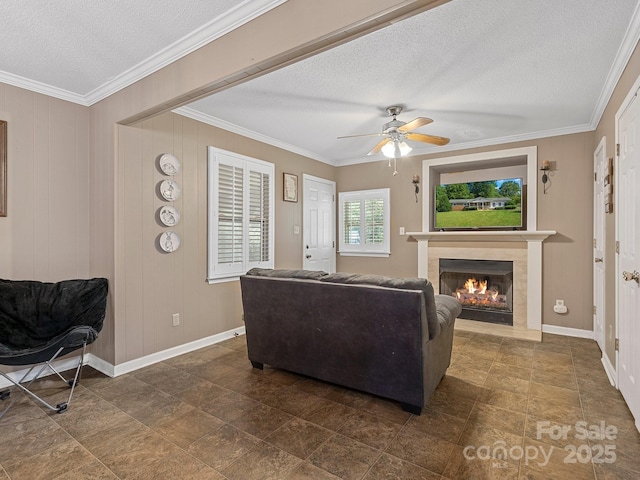 5159 Taxahaw Rd, Lancaster, SC 29720 - living area with a ceiling fan, crown molding, baseboards, a lit fireplace, and a textured ceiling