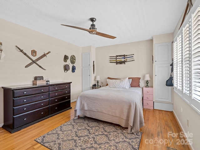 5159 Taxahaw Rd, Lancaster, SC 29720 - bedroom featuring light wood-style floors, a ceiling fan, and baseboards