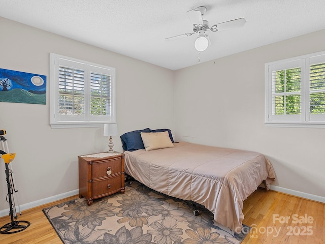5159 Taxahaw Rd, Lancaster, SC 29720 - bedroom with wood finished floors, a textured ceiling, a ceiling fan, and baseboards