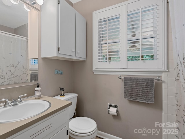 5159 Taxahaw Rd, Lancaster, SC 29720 - bathroom with vanity, curtained shower, and toilet