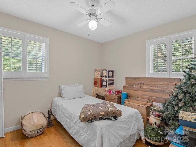 5159 Taxahaw Rd, Lancaster, SC 29720 - bedroom with wood finished floors, baseboards, and ceiling fan