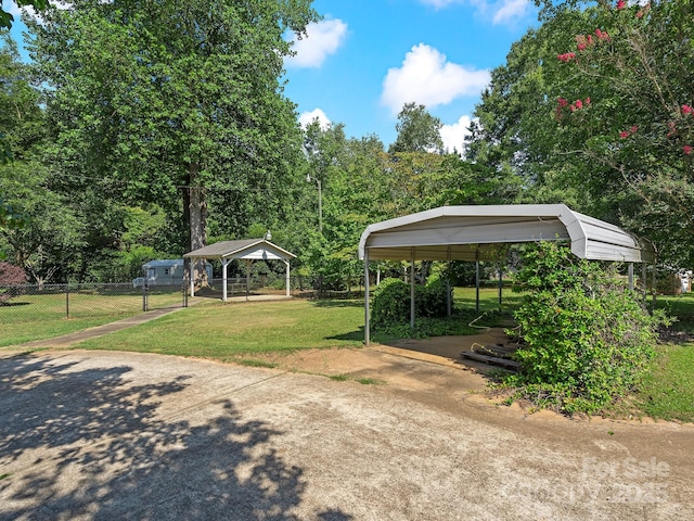 5159 Taxahaw Rd, Lancaster, SC 29720 - view of parking with concrete driveway, fence, and a carport
