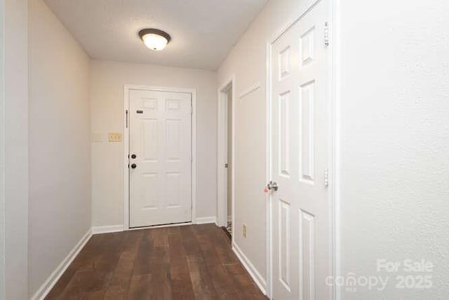 1965 Leesburg Dr, Clover, SC 29710 - doorway featuring baseboards and dark wood-type flooring
