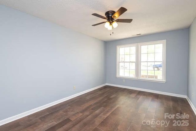 1965 Leesburg Dr, Clover, SC 29710 - spare room with baseboards, a ceiling fan, and dark wood-style flooring