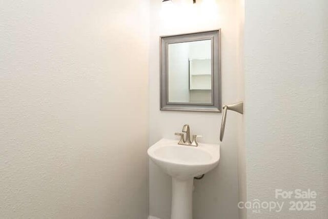 1965 Leesburg Dr, Clover, SC 29710 - bathroom featuring a sink and a textured wall