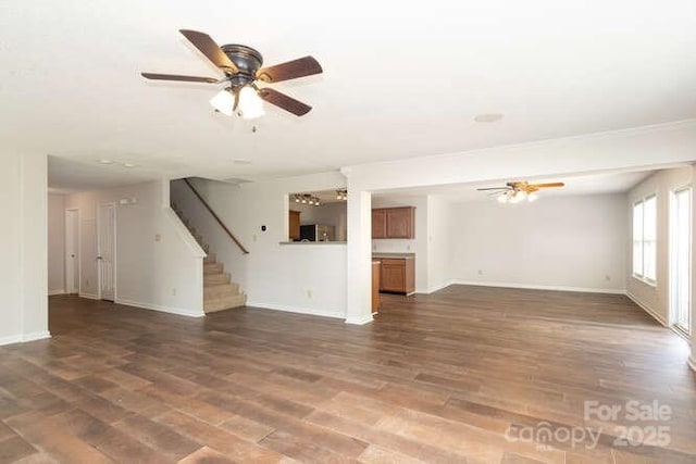 1965 Leesburg Dr, Clover, SC 29710 - unfurnished living room with baseboards, ceiling fan, stairs, and wood finished floors