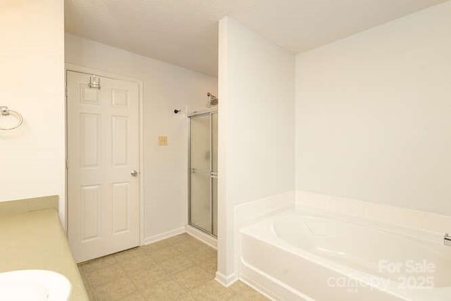 1965 Leesburg Dr, Clover, SC 29710 - full bathroom featuring baseboards, a stall shower, and a bath