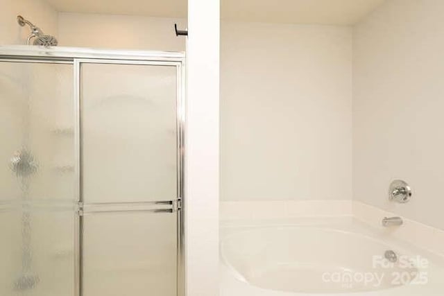 1965 Leesburg Dr, Clover, SC 29710 - bathroom with a bath and a stall shower