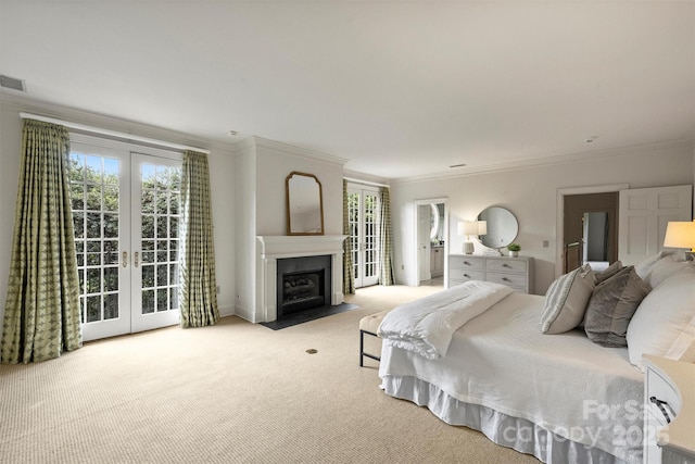 carpeted bedroom with a fireplace with flush hearth, french doors, visible vents, access to outside, and ornamental molding