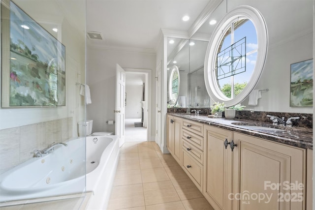 bathroom with double vanity, visible vents, toilet, a tub with jets, and ornamental molding
