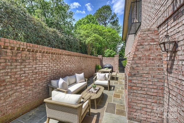 view of patio / terrace featuring a fenced backyard and outdoor lounge area
