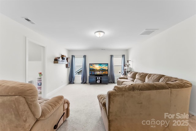 living area featuring light carpet and baseboards
