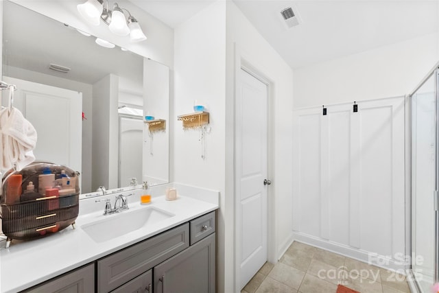full bathroom featuring tile patterned floors and vanity