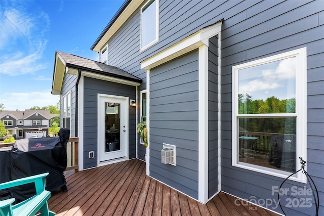 wooden deck with area for grilling