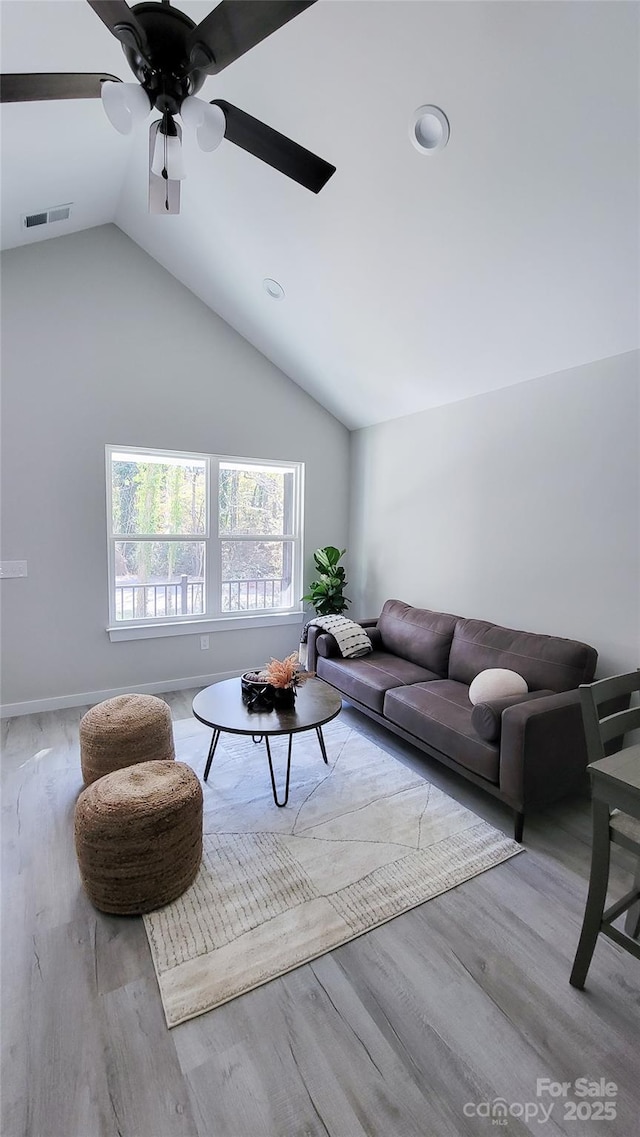 721 32nd St NE, Conover, NC 28613 - living area with wood finished floors, ceiling fan, baseboards, visible vents, and lofted ceiling