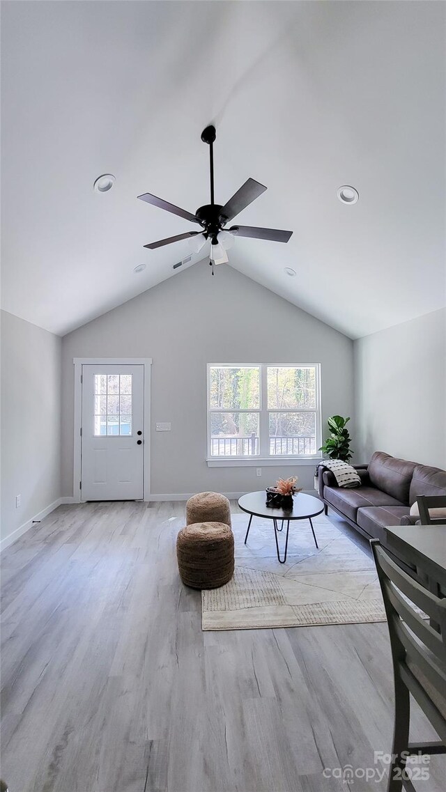 721 32nd St NE, Conover, NC 28613 - living area featuring ceiling fan, visible vents, vaulted ceiling, baseboards, and wood finished floors