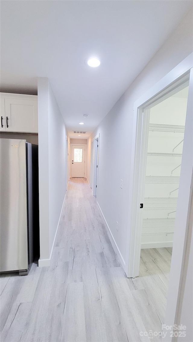 721 32nd St NE, Conover, NC 28613 - hall featuring recessed lighting, visible vents, baseboards, and light wood-type flooring