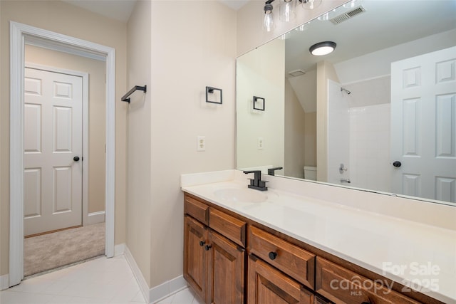 full bathroom featuring walk in shower, toilet, vanity, baseboards, and visible vents