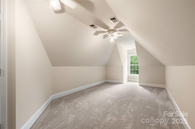 bonus room with visible vents, ceiling fan, and carpet flooring