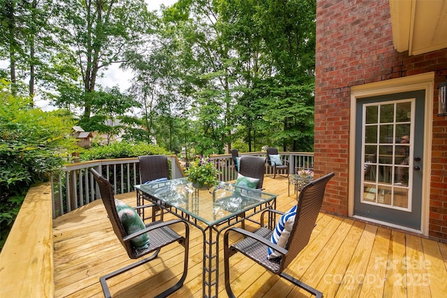 wooden deck with outdoor dining area