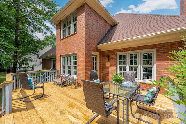 deck with outdoor dining space