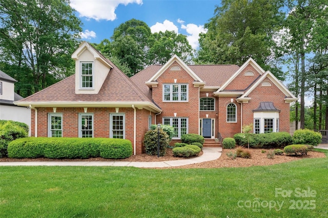 15535 Eagleview Dr, Charlotte, NC 28278 - view of front of house featuring a front lawn, brick siding, and a shingled roof